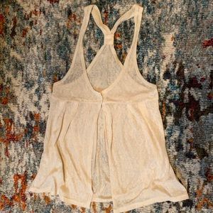 Translucent, cream-coloured, sweater-vest